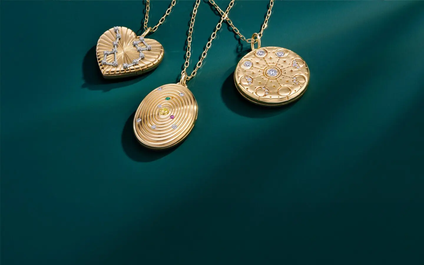 Assortment of gold pendant necklaces perfect for Mother's Day gifting.
