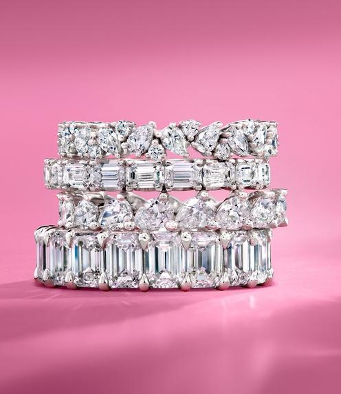 Stack of women's diamond wedding rings.