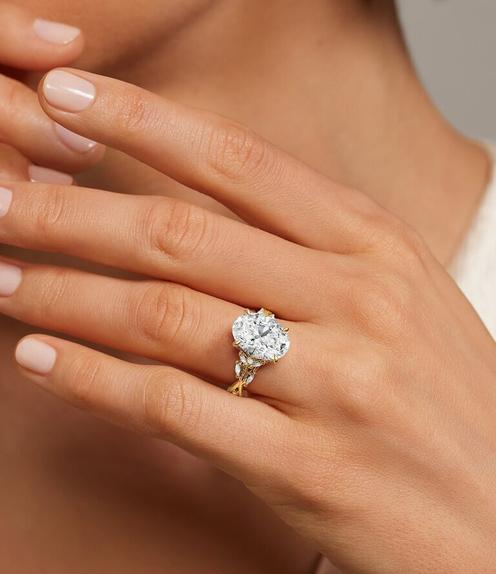 Model wearing ethical diamond engagement ring.