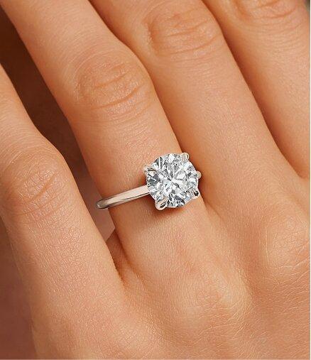 Model wearing ready to ship diamond engagement ring.